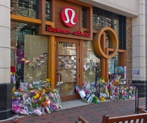 Pictures, flowers and stuffed animals surround the entrance to the Bethesda outpost of Lululemon, after Jayna Murray's murder.